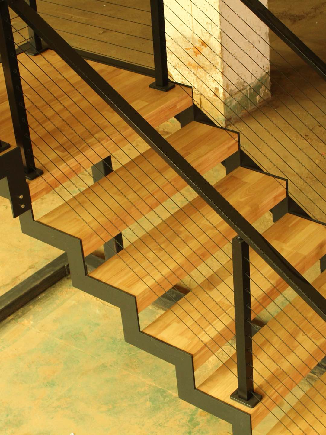 Eco-friendly stairs blend steel wood seamlessly.